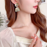 2025 exaggerated heavy industry new earrings wholesale ethnic style zircon water drop fringed three-dimensional wind chime earrings