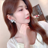 2025 popular New Temperament Niche Retro Earrings Metal Hollow Zircon Butterfly Earrings Premium Pearl Earrings