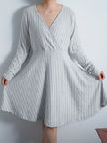 Romildi Plus Size Elegant Sweater Dress, Women's Plus Solid Long Sleeve Surplice Neck Ribbed Knit Nipped Waist Pleated Sweater Dress